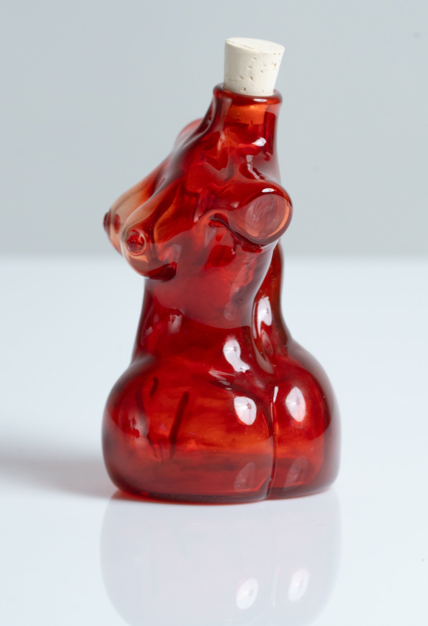 Small Glass Female Torso Flask in Red.