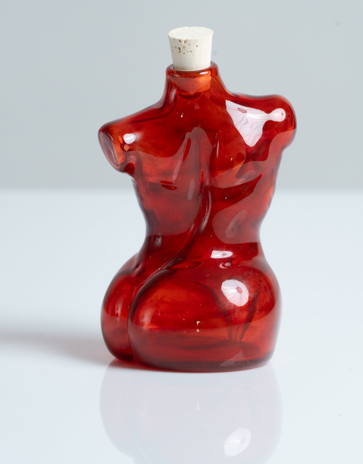 Small Glass Female Torso Flask in Red.