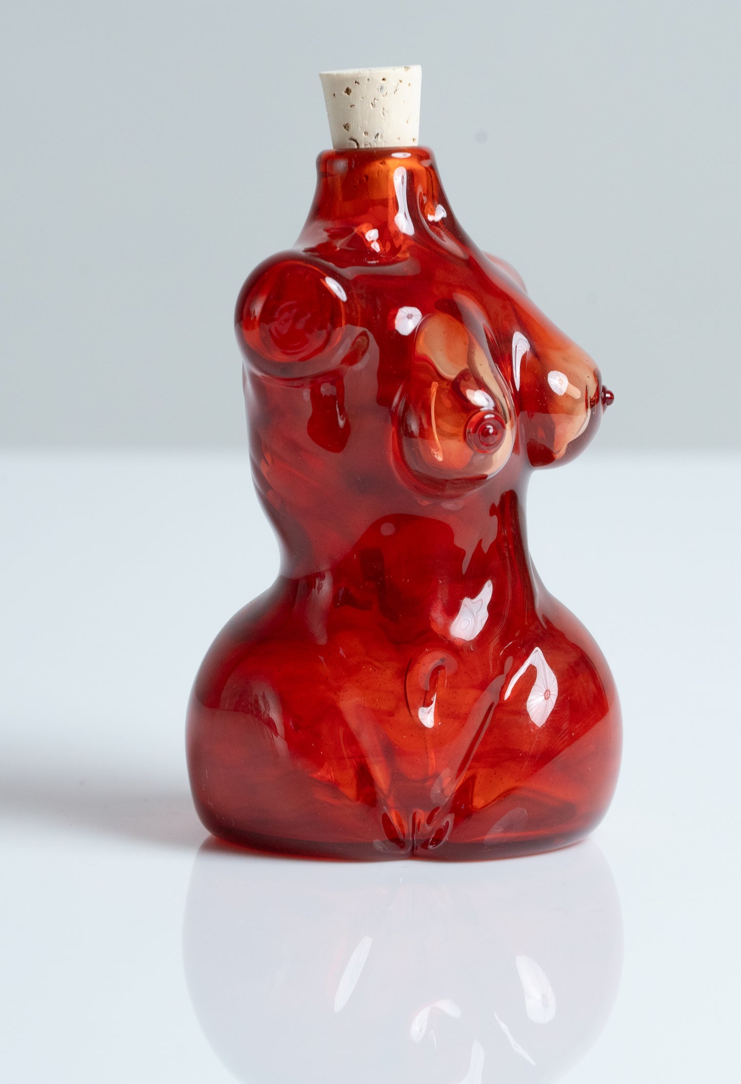 Small Glass Female Torso Flask in Red.